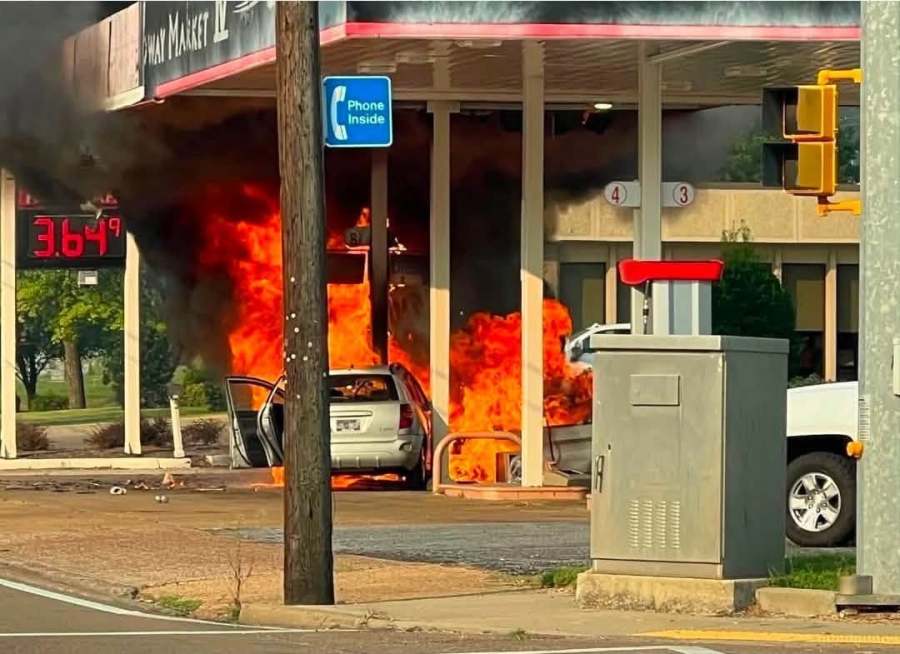 Driver pulled from burning car after crashing into gas pump